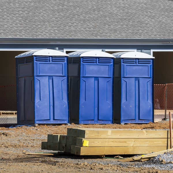 what is the cost difference between standard and deluxe portable toilet rentals in Servia